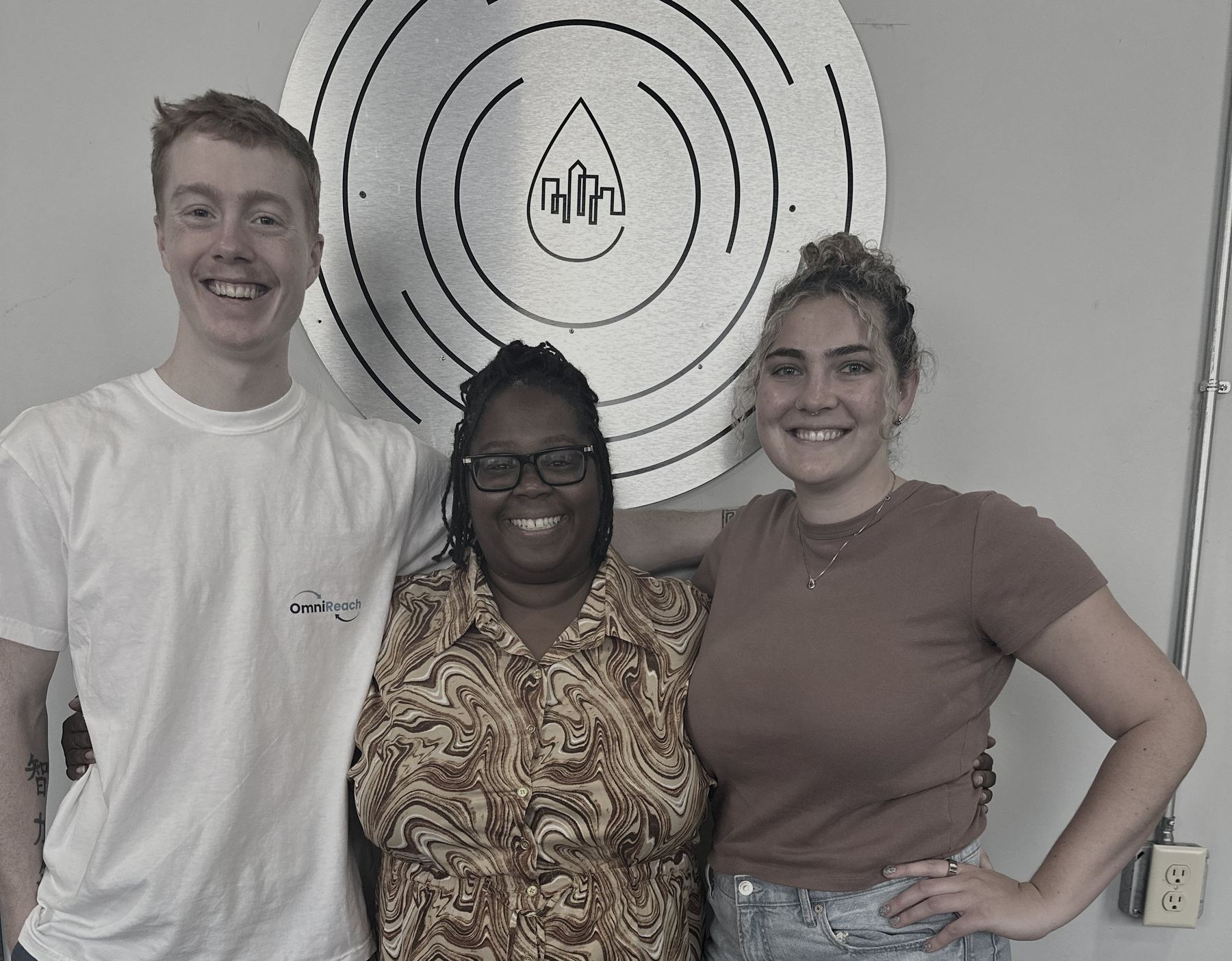 The OmniReach Media team with a client