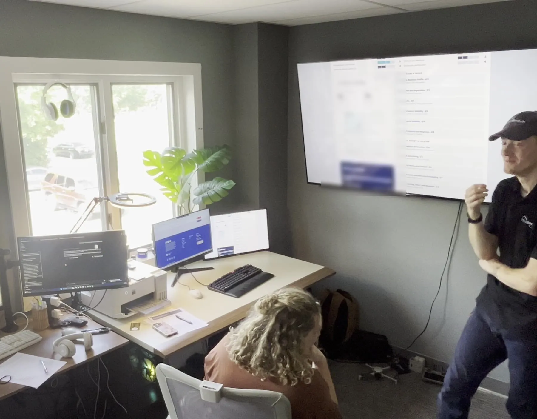 Jacob and Kayla Brillhart reviewing a client marketing audit at the OmniReach Media office in Akron, Ohio