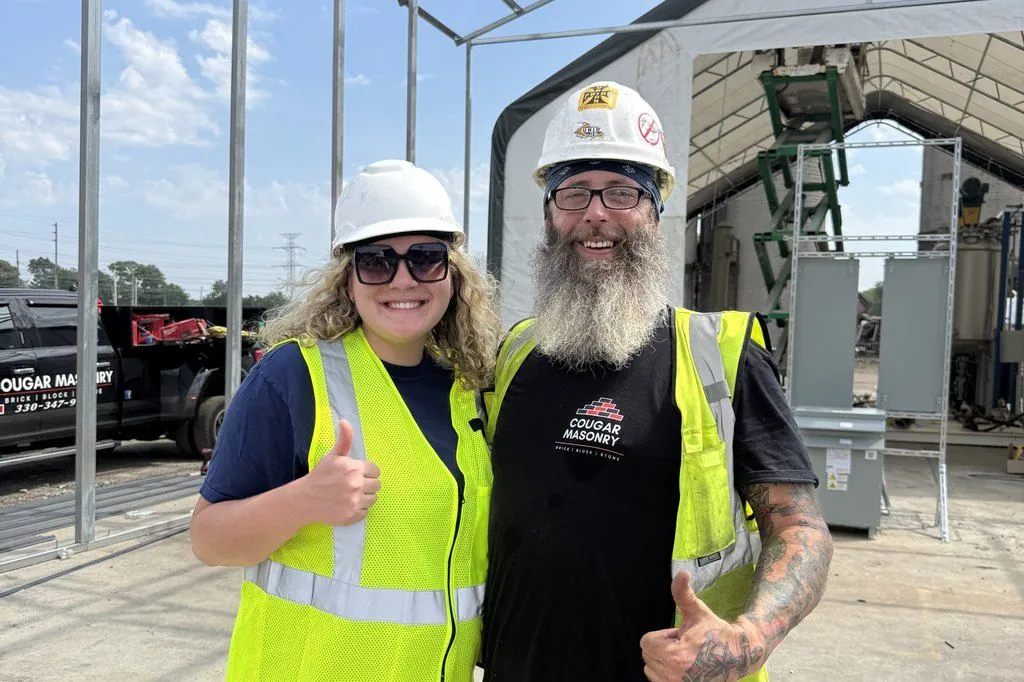 Kayla Brillhart of OmniReach Media on site with Cougar Masonry owner Christopher Shields